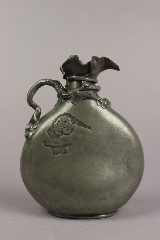 Pitcher with two profiles by Jules Desbois